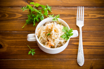 sauerkraut with carrots and spices in a bowl