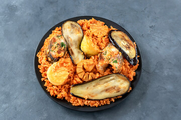 Thieboudienne is a traditional dish from Senegal. Prepared with fish, rice and tomato sauce cooked in one pot.