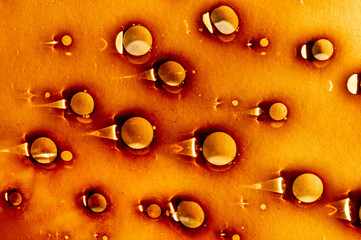 Abstract oil painting. Creative wet liquid illustrations. Fluid art. Blobs and drops on paper texture. Orange, yellow and white colors