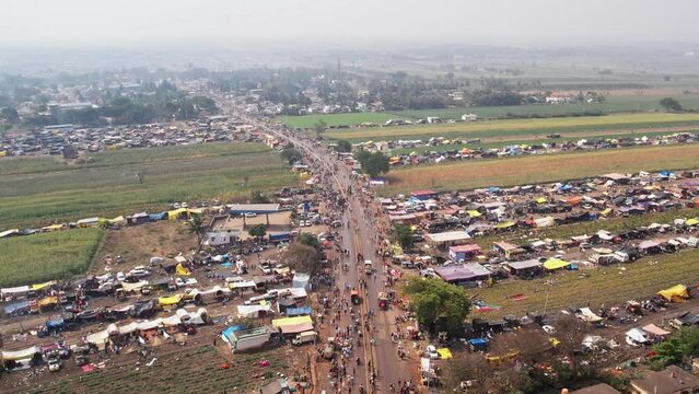 Huge crowded road with huge tents and shelters at the annual fair