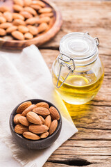 Almond oil and seeds (Prunus dulcis) close-up image