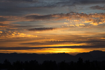 Fototapeta na wymiar Spectacular and colorful sunrise on the horizon in Murcia 