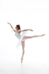 One Caucasian young beautiful ballet dancer in tutu and ballet shoe isolated on white background. Sport, art concept. 