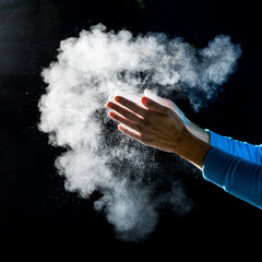 Creating a climbing magnesium cloud with the hands - obrazy, fototapety, plakaty