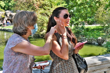 Mother and Daughter, enjoying park together in summer