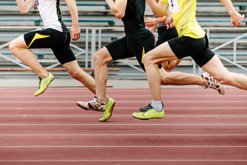 men athletes runners running race sprint in athletics