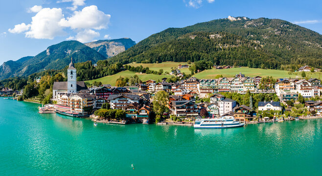 Idyllic View of St. Wolfgang Chapel and Village Waterfront. Explore the Serene Beauty of Wolfgangsee Lake in Austria