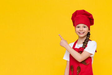 The chef is a little girl in a red cap and apron, pointing her finger to the side and your...