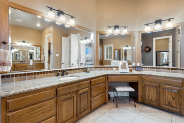 A large master bathroom with white accenting 