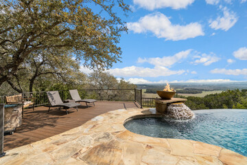 A pool with views of green hills