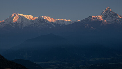 Fototapeta na wymiar View of the Himalayan giants, Dhaulagiri mountain, Annapurna range and Machapuchare (Fish Tail) mountain as seen at sunrise from Sarangkot village, near Pokhara, Nepal Himalayas, Nepal