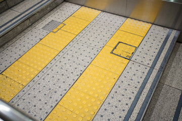 Fototapeta premium Tactiles paving on the staircase to subway station