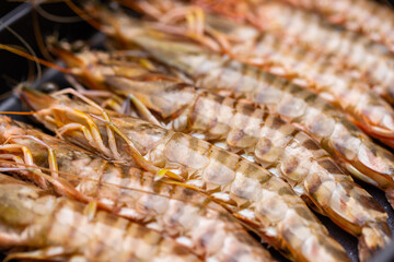 Fresh raw shrimp on grill pan