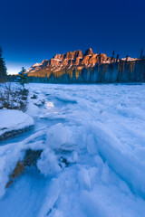 winter landscape with frozen river and mountains