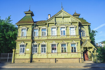Fototapeta premium old wooden mansion in the form of a terem, Russian wooden architecture, Russia, Kostroma, sunny summer day