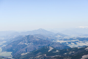Fototapeta premium Beautiful view of the snowy mountains with blue sky , no clouds during day in the spring. Spring meadow with snow and knee-timber. West Tatras, Slovakia, Liptovsky Mikulas.