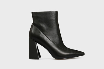 Black pointy toe women's ankle boot with high heels isolated on white background. Female classic, spring, autumn shoe. Blank casual leather footwear with unusual heel. Single. Mock up, template
