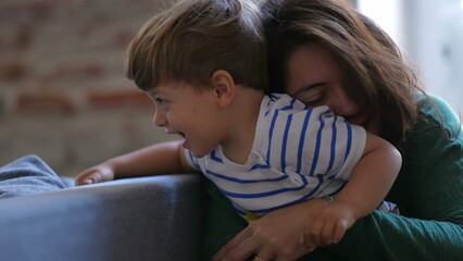 Obraz premium Motherhood love and affection. Parent hugging and embrace little boy son. Mom caring for child. Parenthood lifestyle