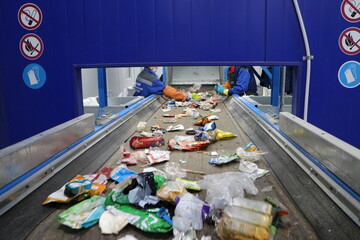conveyors in the workshop of a waste sorting plant