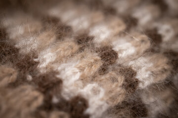 Abstract background. Knitted fabric. Texture pattern of wool yarn close up