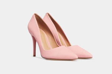 Light pink pointy toe women's shoes with high heels isolated on white background. Female classic stiletto heels in suede leather. Mock up, template