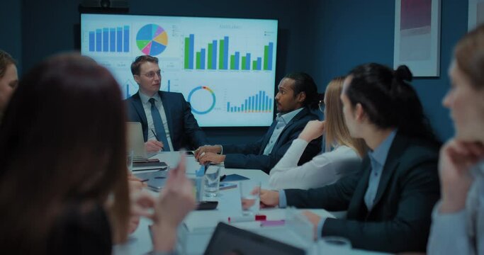 african american man is talking with colleagues in business meeting in boss office, 4K, Prores