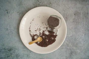 Brown Mustard Seed spread a White Plate