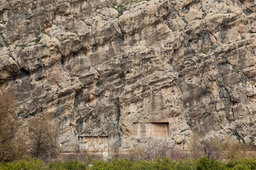 Fototapeta na wymiar Rock Relief of Bahram II and Sasanid Army, Chogan Valley, Iran