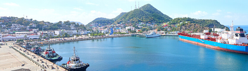 Fototapeta na wymiar Panoramic View of Manzanillo city , tropical Colima, Mexico. Waterfront Harbour Pier at Cruise ship terminal.