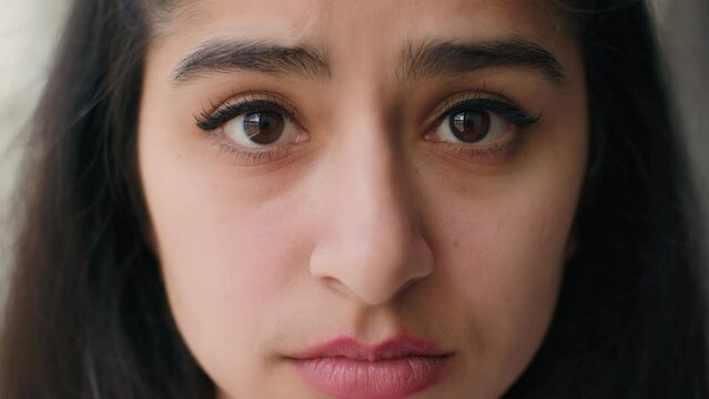 Close up woman sad face with big eyes anxious upset frustrated young teen girl businesswoman feel stress worry relations problem depression shame sorrow. Front head portrait female victim of bullying