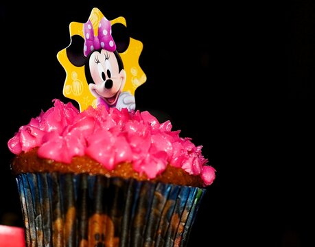 Cup Cake with a Minnie Mouse picture on it