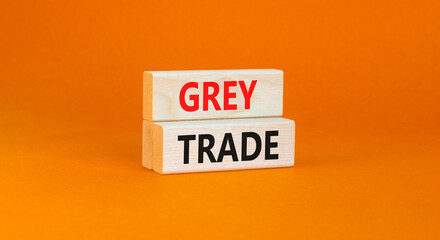 Grey trade symbol. Concept words Grey trade on wooden block. Beautiful orange table orange background. Business grey trade concept. Copy space.