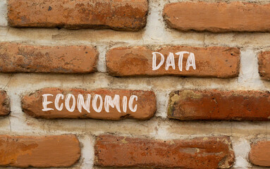 Economic data symbol. Concept words Economic data on red brown brick wall. Beautiful red brown brick wall background. Business economic data concept. Copy space.