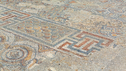 Archaeological remains with decorative tile floors and frescoes paintings in a hillside house on...