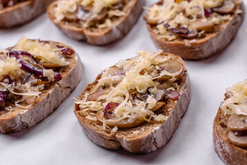 Delicious crispy toast or bruschetta with fried onion, champignon mushrooms and cheese