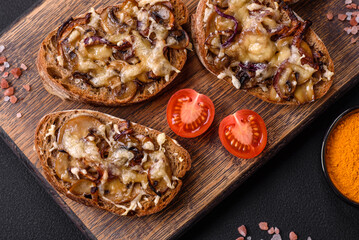 Delicious crispy toast or bruschetta with fried onion, champignon mushrooms and cheese
