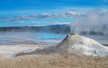 Mini volcano fumarole cone emit sulphuric gas, steaming hot blue natural pool, geothermal surreal volcanic field,  icelandic nature landscape - Seltun / Krysuvik, Iceland