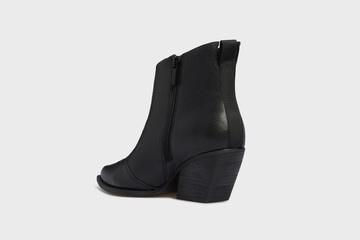 Back view on black women's fashion cossack Cowboy boot isolated on white background. Female classic spring autumn shoe with Pointy Toe, heel. Leather casual footwear. Behind