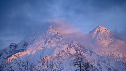 Alpenglow sunset over snowy Alaska mountains