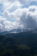 White clouds over mountains in Alps