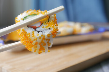 Sushi roll with salmon, shrimps and avocado 