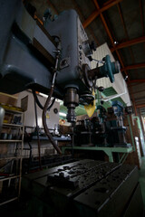 Fototapeta na wymiar Machining with a radial drilling machine 
