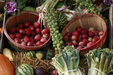Pumpkins with vegetables and fruit at farmer's market.