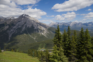  Alpine mountain landscape with snow-capped peaks and coniferous forest in Banff National Park, Alberta, Canada