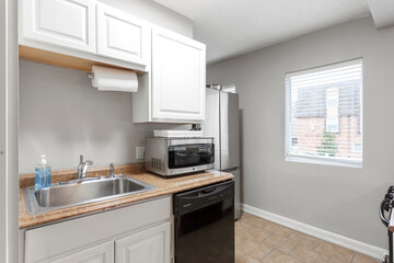 modern interior of a white apartment with open floor layout long term rental loft