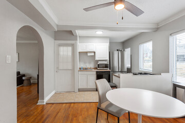 modern interior of a white apartment with open floor layout long term rental loft