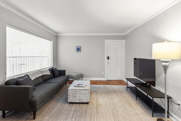 modern interior of a white apartment with open floor layout long term rental loft