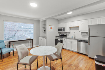 modern interior of a white apartment with open floor layout long term rental loft