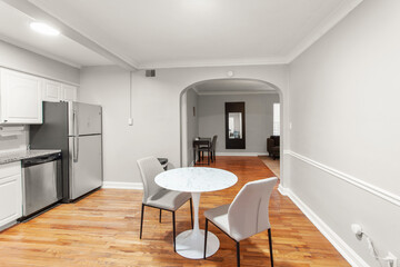 modern interior of a white apartment with open floor layout long term rental loft