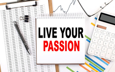 LIVE YOUR PASSION text on notebook with chart, calculator and pen